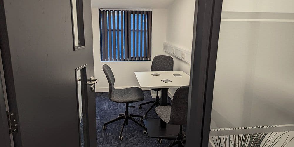 A private office at The Kingsbridge Office, with desks and ergonomic chairs